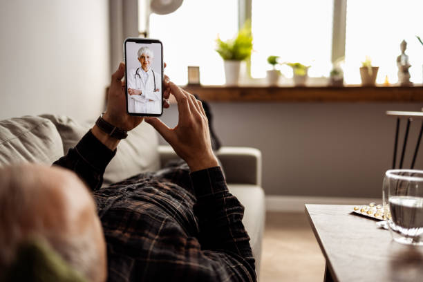 istock Doctor on video call with disabled senior patient 1391378342