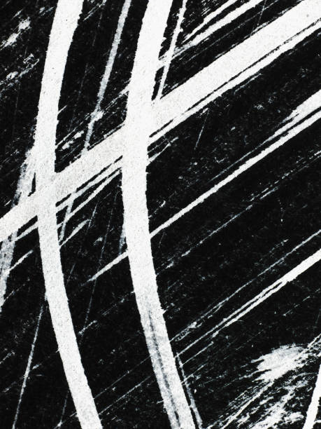 Patterns of white paint from a brush on a black background. Vertical Patterns Abstract texture or background wall. white paint pattern over black. Vertical orientation scuff marks photos stock pictures, royalty-free photos & images