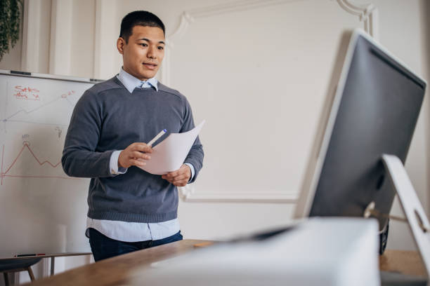 istock Business man having video conference call and presenting some ideas 1391378788