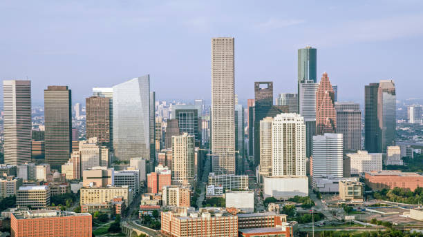 Aerial view of skyscrapers in downtown Houston against cloudy sky, Texas, USA.