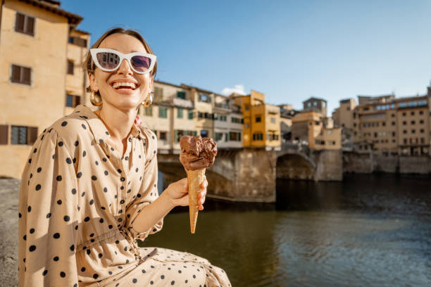 woman with italian ice cream in florence, italy - ponte vecchio imagens e fotografias de stock