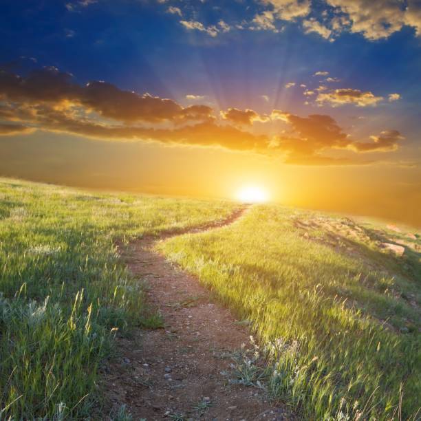 istock road among a hills at the sunset 1391381471