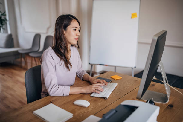 istock Young businesswoman working on computer in the office 1391381565