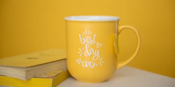 istock Yellow mug and books 1391391376