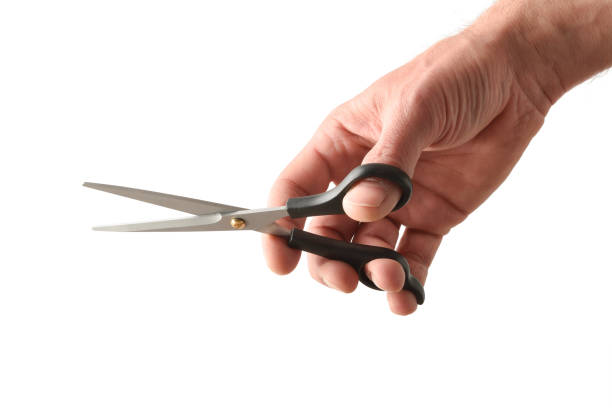 istock Barber with scissors in hand and white isolated background 1391392388