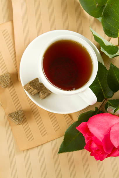 istock Cup of tea and rose 1391392407