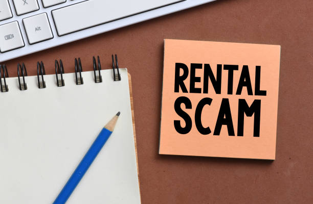 istock RENTAL SCAM words on a small sheet of paper. 1391393877