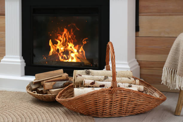 istock Firewood in wicker baskets near fireplace indoors 1391394161