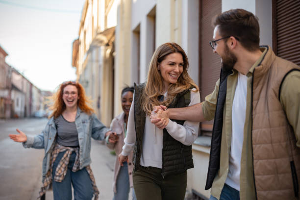 istock Happy couple walking with their friends 1391395169