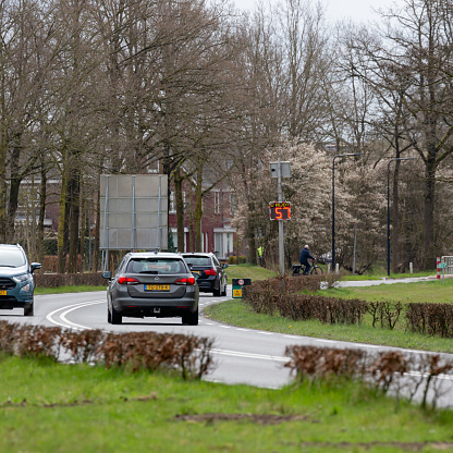 Borne, Twente, Overijssel, Netherlands, april 8th 2022, close-up of a digital sign showing the measured speed of each car driving by on a sunny day in Borne (Overijssel), speed limit on this road is 50 kmh, as a result the actual speed of 57 kmh is showed in red, this type of automatic traffic speed measurement is premonitory

Borne as a municipality has a population of 24.000 (2022)