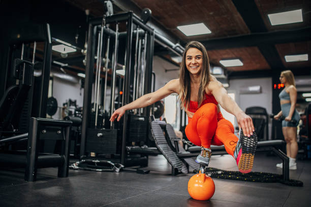 istock Fit woman exercising in gym 1391398556