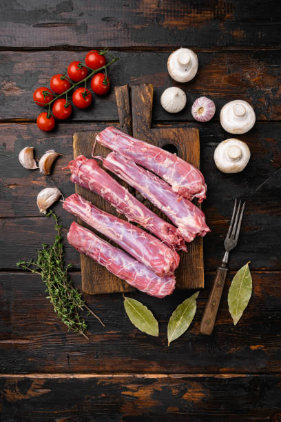 istock Raw chicken neck, on old dark  wooden table background, top view flat lay 1391401521