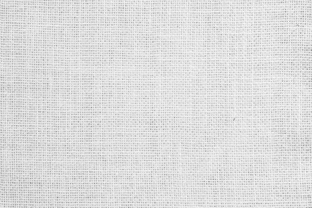 istock White fabric jute hessian sackcloth canvas woven gauze texture pattern in light white color blank. Natural linen and cotton cloth texture as clean background empty for decoration. 1391402742