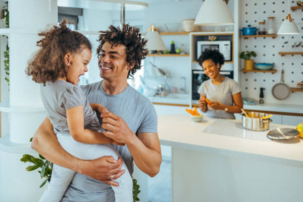 istock Father holding small daughter in the arms. 1391402828