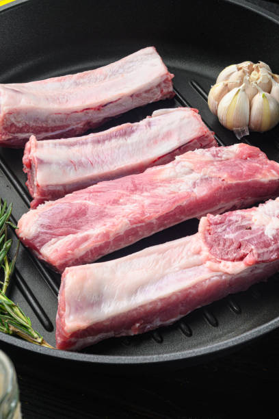 istock Raw ribs with a rosemary and vegetables 1391404207