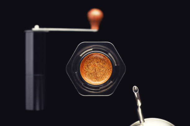 istock Brewing coffee alternative method aeropress with coffee beans and kettle in focus, coffee grinder blurred. 1391404830