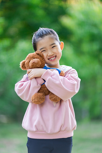 Cute Little Girl Embracing Teddy Bear
