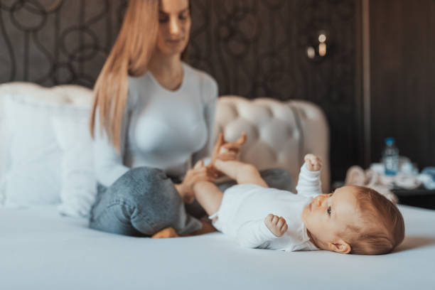 istock The toddler enjoys while her caring mother massages her feet 1391407609
