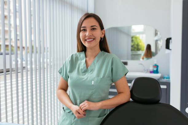 Let's get these teeth looking good again Portrait of a confident young woman working in a dentist’s office dental hygienist stock pictures, royalty-free photos & images