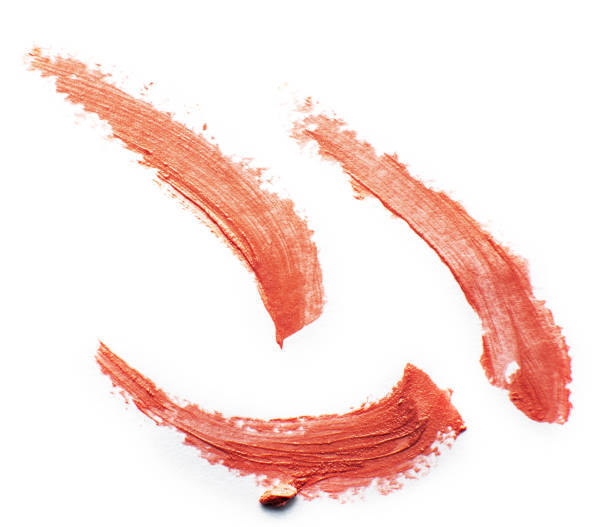 istock Lipstick smear smudge swatch isolated on white background. Cream makeup texture. 1391412046