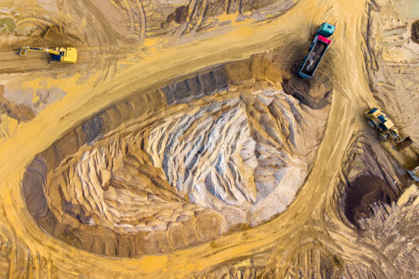 istock Gravel and sand open pit mining, sand hills - aerial view 1391413319