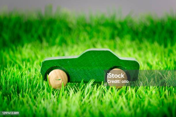 Wooden Toy Car On Green Grass Concept Of Sustainable Mobility Stock Photo - Download Image Now