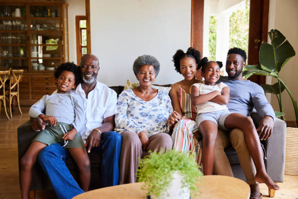 istock Smiling multi-generation family sitting together on a living room sofa 1391414809