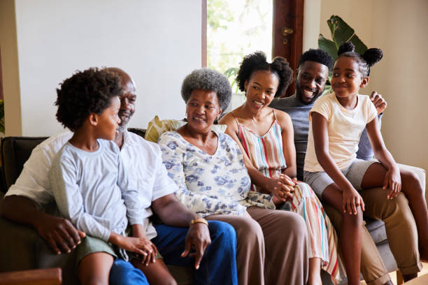 istock Smiling multi-generation family talking together on a living room sofa 1391416565