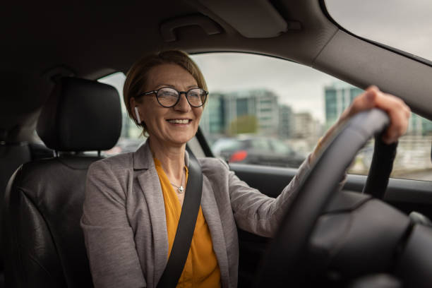 istock Mature woman driving a car 1391418378