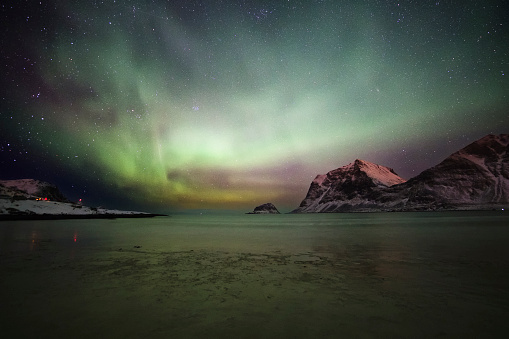 Photo of an aurora borealis at the lofoten Islands in Norway.