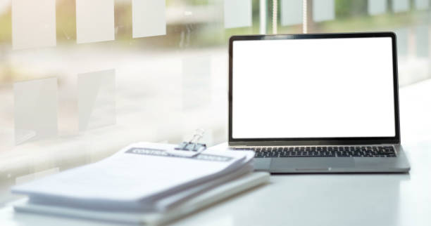 istock Laptop or notebook with blank screen on the floor service counter in the office. 1391420078