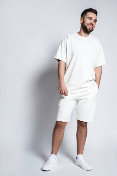 istock Handsome man wearing white sweatshirt and shorts 1391420996