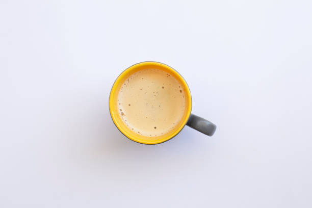 istock White coffee with milk in a mug view from top isolated over white background. 1391421357