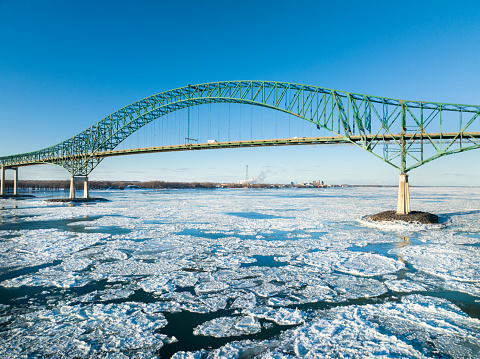 Laviolette Bridge, during winter, crossing the St. Lawrence River and ice floe in Trois-Rivieres, Quebec, Canada