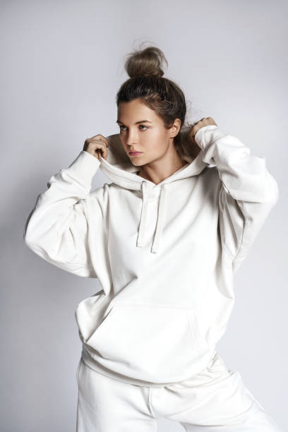 Young woman stylish woman wearing white hoodie stock photo