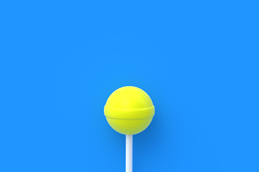 Yellow lollipop on stick on blue background. Sweet candy. Confectionery goods. Copy space. 3d render