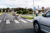 Careless mother speaking by phone while her baby pram rolled out on the road