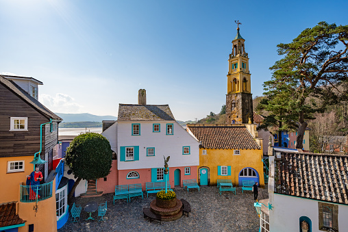 Wide angle view of colourful buildings at Portmeirion village. Portmeirion is a village in Gwynedd, North Wales.