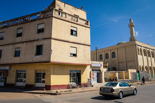 Asmara, Eritrea - November 02, 2019:  Beige Local Building near the Central street of Asmara