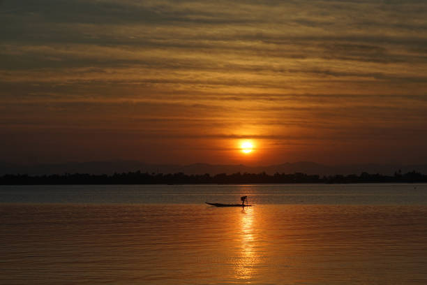 This photo was captured during sunrise on August 10,2019 at Tacloban City bay. This fisherman circling around his area to check his net traps.