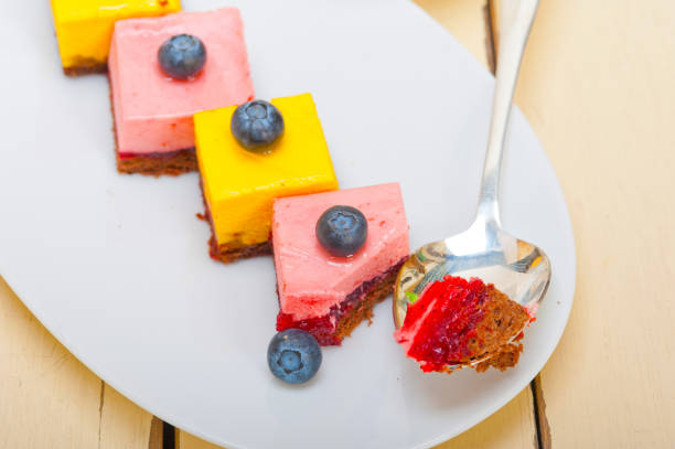 fresh strawberry and mango mousse dessert cake with blueberry