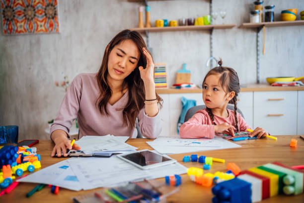 istock Worried mother going through her financials 1391441416