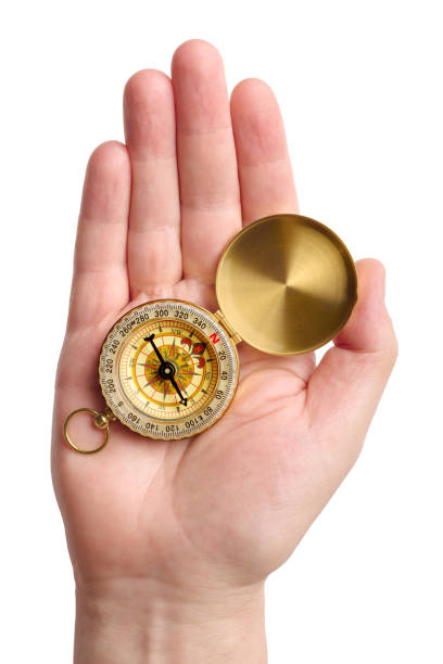 istock Hand holding traditional magnetic compass 1391441478