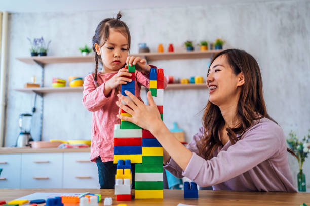 istock Mother and daughter playing together 1391441579