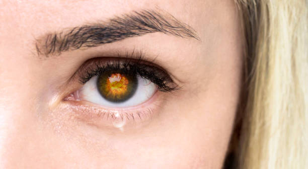 istock Woman's eye with a tear. War concept. 1391441584
