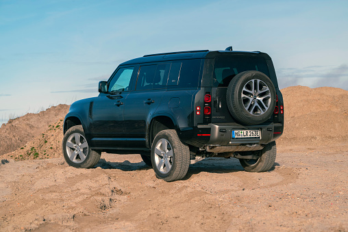 Berlin, Germany - 27th March, 2022: Land Rover Defender 110 PHEV on the off-road. This vehicle is used to get in extremely hard areas.