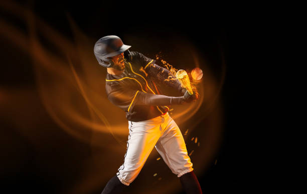 Professional baseball player in sports equipment training alone isolated on dark background with mixed light effect. Sport, art, action, hobby concept Professional baseball player in sports equipment training alone isolated on dark background with mixed light effect. Sport, art, action, hobby concept. Poster, flyer with sportive man game swing stock pictures, royalty-free photos & images