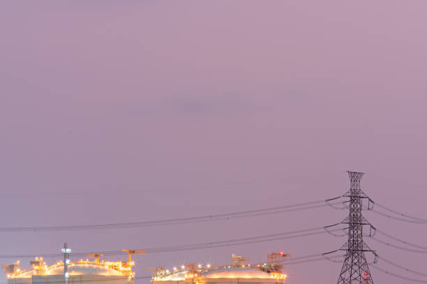 istock High voltage power station. High voltage electric tower on sunset background. Electrical power lines and towers at sunset. Industrial on Twilight sky. petrochemical plant. 1391443795