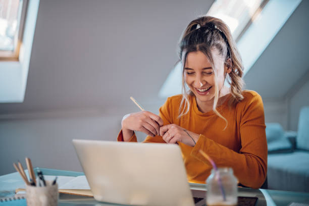 istock Woman having web call on a laptop while working at home 1391448221