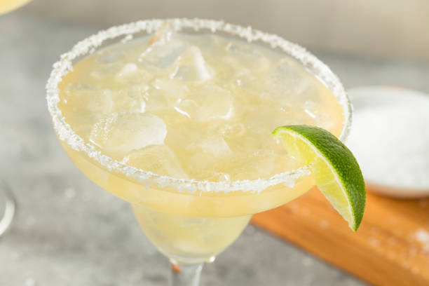 Boozy Refreshing Tequila Margarita Boozy Refreshing Tequila Margarita with Lime and Salt margarita stock pictures, royalty-free photos & images